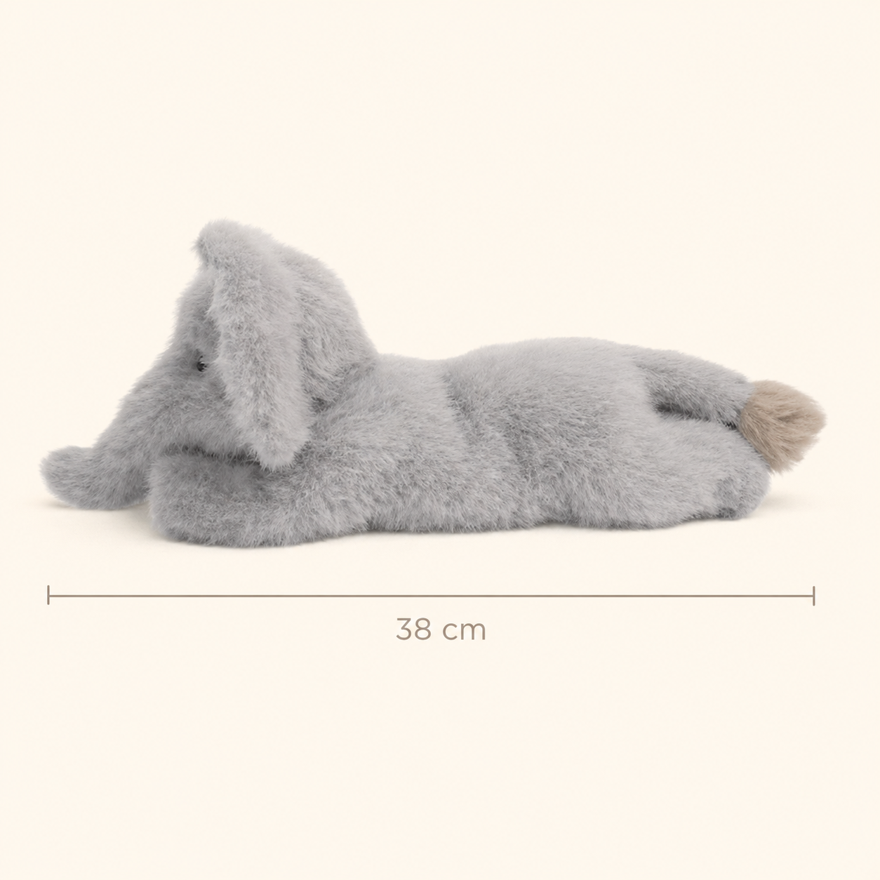 Side view of One Love Snuggles Tai Elephant plush toy showing its 38 cm length