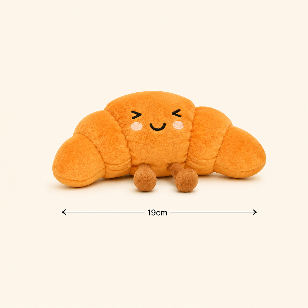 Croissant Besitos plush toy with horizontal 19cm width measurement guide on a soft cream background Plushies South Africa