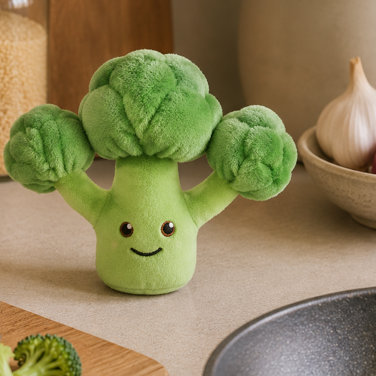 Broccoli Besitos plush toy displayed on a warm kitchen countertop beside fresh broccoli, wooden utensils and natural Scandinavian-inspired décor Plushies South Africa