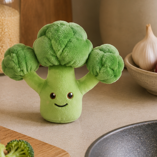 Broccoli Besitos plush toy displayed on a warm kitchen countertop beside fresh broccoli, wooden utensils and natural Scandinavian-inspired décor Plushies South Africa