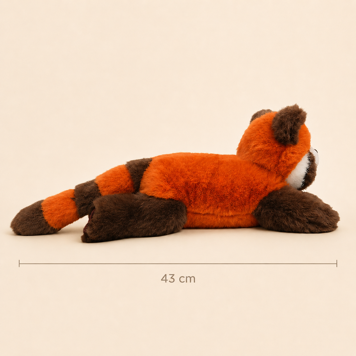 Side view of One Love Snuggles Rusty red panda plush toy showing its 43 cm length