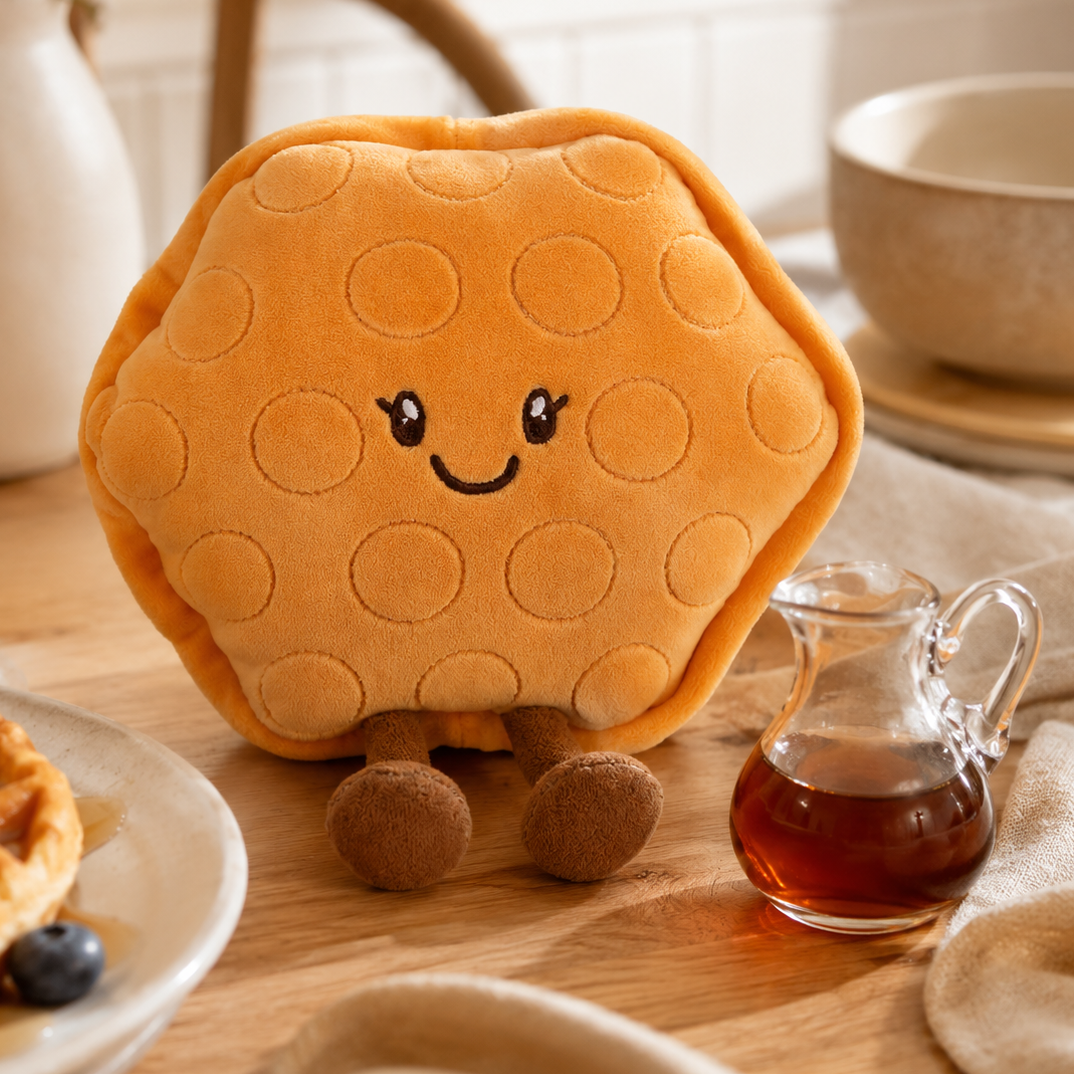 Waffle Besitos plush toy displayed on an oak breakfast table beside a real waffle, blueberries and maple syrup in a warm kitchen setting Plushies South Africa